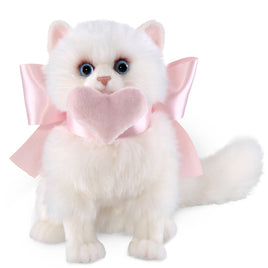 White kitten plush toy with pink bow and heart on a white background