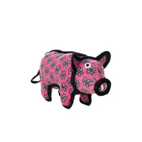 Pink pig-shaped dog toy with black accents on a white background