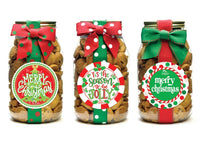 Three jars of dog treats with Christmas-themed labels and bows on a white background