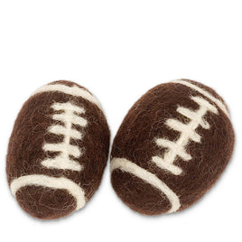 Two brown felted football-shaped cat toys with white stitching. handmade in nepal