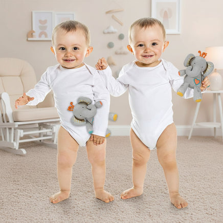 Two babies in white onesies holding gray elephant toys on a white background