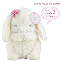White plush bunny with pink flower and speech bubble on a white background