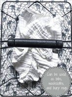 White washcloth on a black wire rack with text overlay