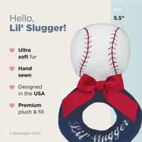 Baseball-shaped plush toy with red bow and 'Lil' Slugger' text on a light background