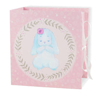Gift bag with a blue bunny illustration on a pink background
