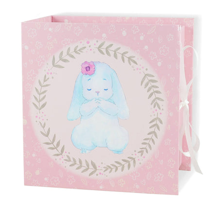Gift bag with a blue bunny illustration on a pink background
