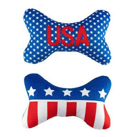Two bone-shaped pillows with American flag design and 'USA' text on a white background
