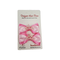 Pink dog hair bow with a tiara design on a white card, featuring 'Designer Hair Bows' branding.