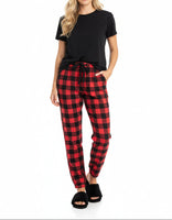 Red and black checkered pajama pants on a white background