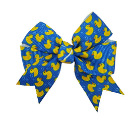 Blue hair bow with yellow rubber duck pattern on a white background