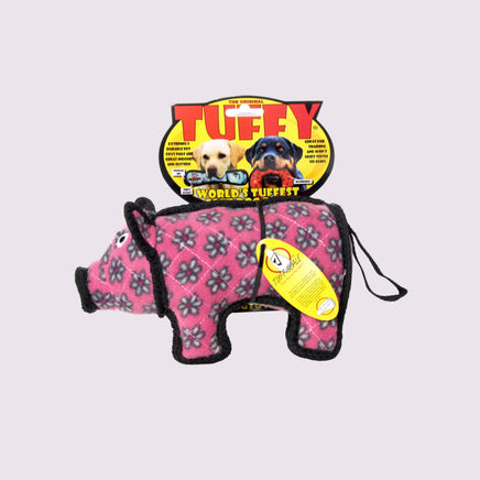 Pink and black pig-shaped dog toy with Tuffy branding on a white background