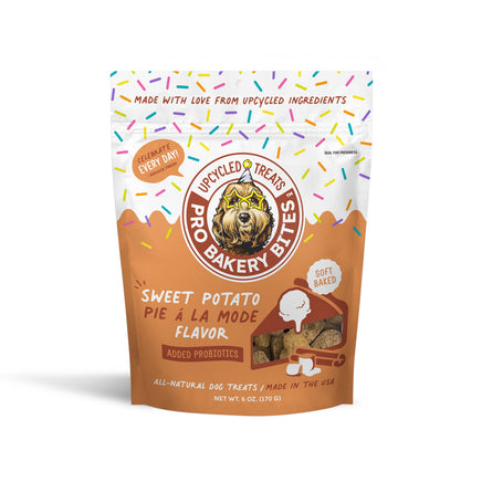 Dog treat package with colorful sprinkles and text on a white background