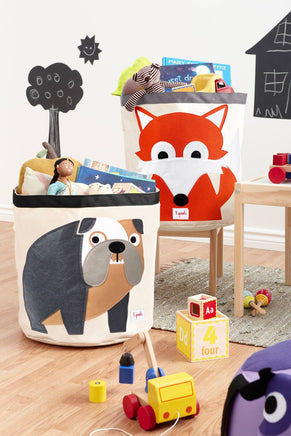 Children's storage bins with animal designs filled with toys in a room setting.