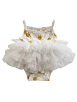 White baby romper with gold sun patterns and a tutu skirt on a white background