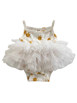 White baby romper with gold sun patterns and a tutu skirt on a white background