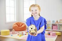 little girl holding a cute plush baby hedgehog toy