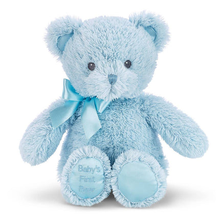 Blue teddy bear with a bow and 'Baby's First Dream' tag on a white background