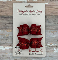 Red glittery hair bows on a card with 'Max's Closet' branding.