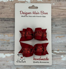 Red glittery hair bows on a card with 'Max's Closet' branding.