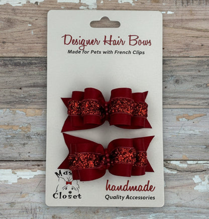 Red glittery hair bows on a card with 'Max's Closet' branding.