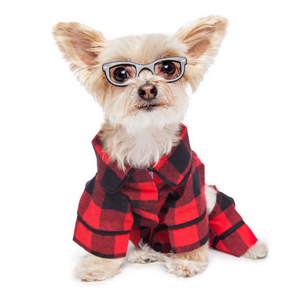 Dog wearing a red and black plaid coat and glasses on a white background