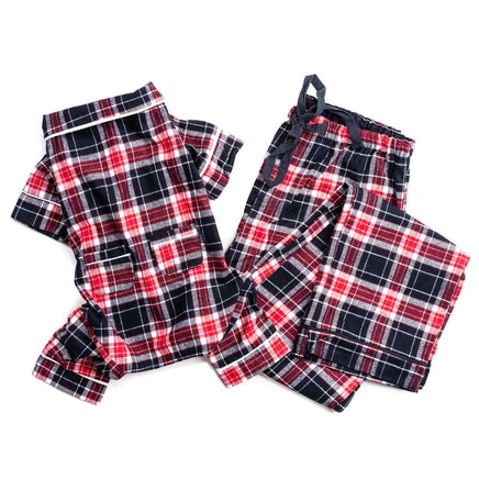 Red, black, and white plaid pajama set on a white background