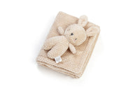 Beige plush toy and blanket set on a white background