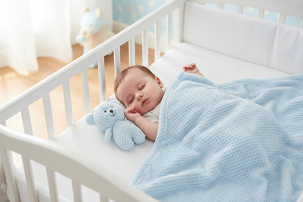 Blue teddy bear and blanket set on a white background