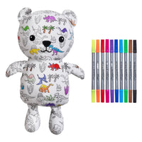 Colorable teddy bear with washable markers on a white background. the print is various dinosaurs