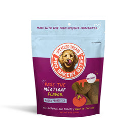 A package of Pro Bakery Bites dog treats with 'Pass The Meatloaf Flavor' text, featuring an image of a dog and a meatloaf, with a 'Made With Love From upcycled Ingredients' tagline.