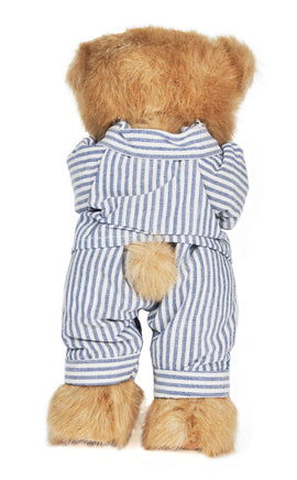 Brown teddy bear wearing a blue and white striped outfit on a white background