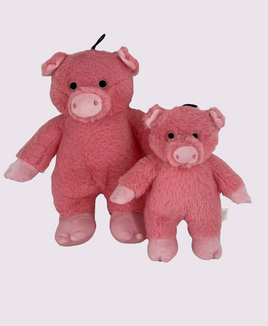 Two pink plush dog squeaky toy pigs on a white background