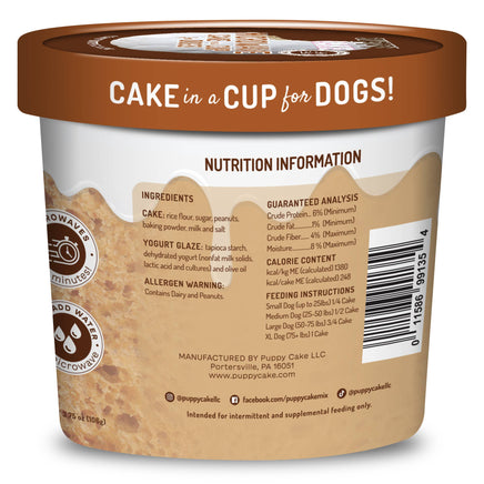 Dog food container labeled 'Cake in a Cup for Dogs' with nutrition information on the back.