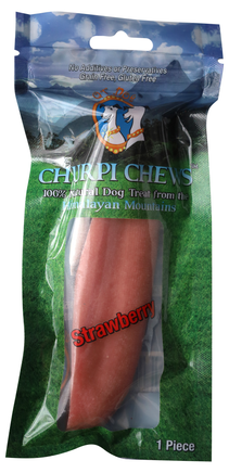 Package of Chirrip Chevs strawberry-flavored dog treat with a blue sky and green grass background.