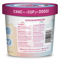 Container of 'Cake in a Cup for Dogs' with nutrition information label.