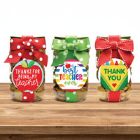 Three jars of cookies with colorful bows and teacher appreciation stickers on a white background
