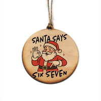 Wooden ornament with Santa Claus illustration and text 'Santa Says Six Seven' on a white background