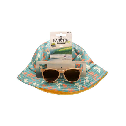 Child in a pool wearing sunglasses and a hat with other children in the background.