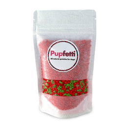 Bag of Pupfetti dog treats with visible red and green sprinkles on a white background
