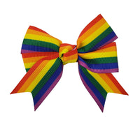 Rainbow striped hair bow on a white background