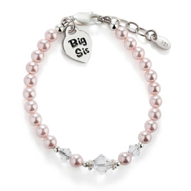 Pink pearl bracelet with 'Big Sis' sterling silver heart charm on a white background