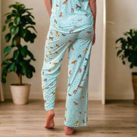 Light blue pajama set with animal pattern on a beige background