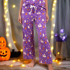 Purple Halloween-themed pajama set on a beige background