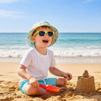 Children's hat and sunglasses set with dinosaur pattern on a white background