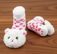 White kitty baby rattle socks non slip bottoms pink and white